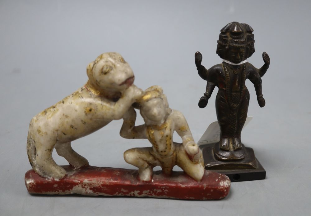 An Indian painted marble group and an Indian bronze of a deity
